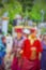 blurred image ofÂ people are praying around stupa